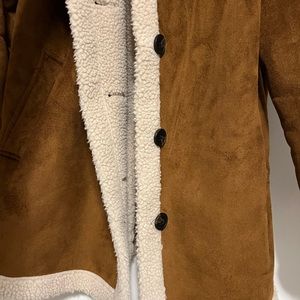 Women’s Lambswool Faux fur coat. Brown outside with cream inside. Size small.